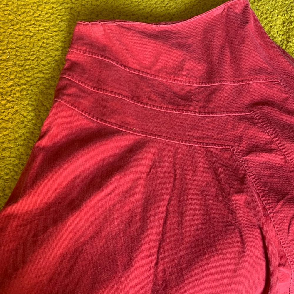 Pink corduroy skirt. Flare. Below the knee.